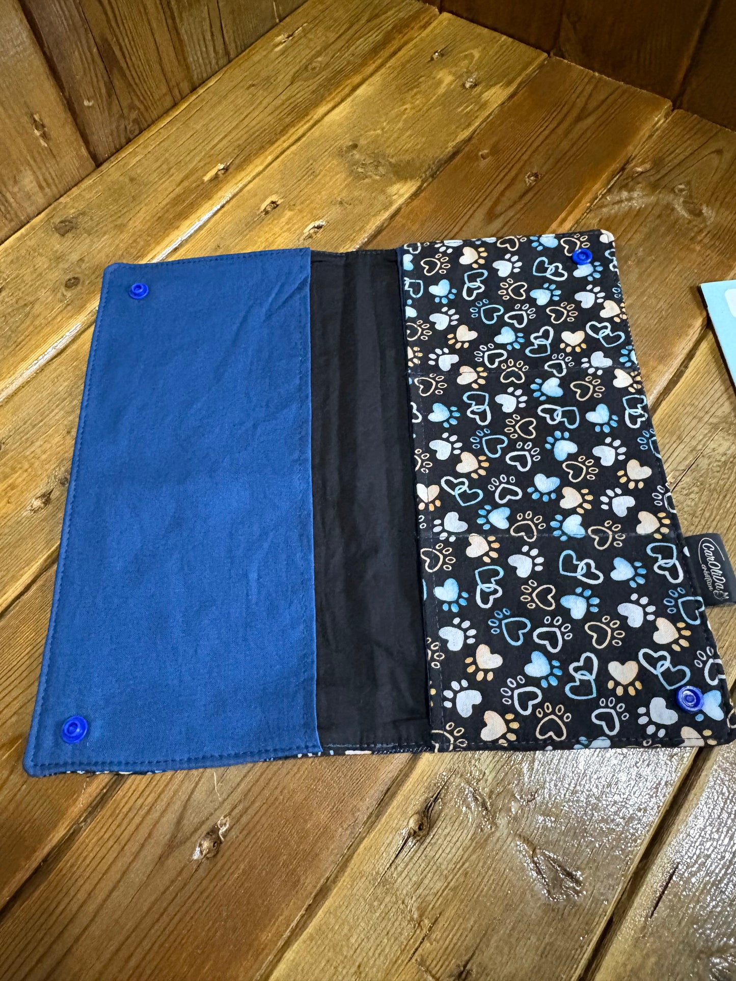 Protège carnet patte/bleu